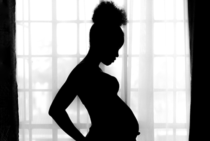 silhouette of pregnant person